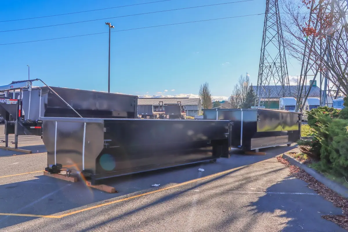 Roll-off dumpster ready for waste disposal at job site for 3 Yard Dumpster Rental in Gilford